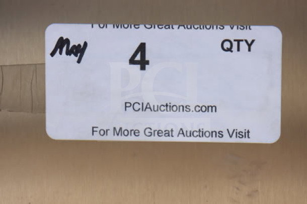 Label reading "For More Great Auctions Visit PCIauctions.com," with quantity "4" handwritten, on a metallic surface.