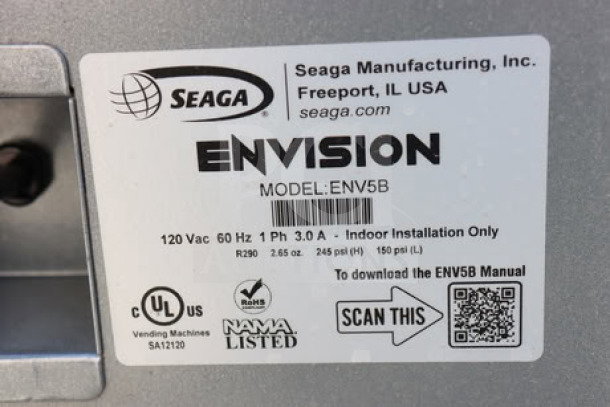 Seaga ENV5B vending machine label showing model, voltage details, certifications, and QR code for manual download.