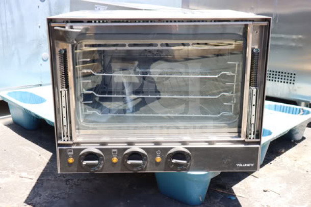 Brand new Vollrath CO4-120HS half-size countertop convection oven, 120V, stainless steel, three racks, controls visible.
