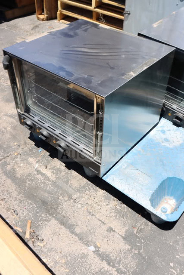 Brand new Vollrath CO4-120HS half-size convection oven, 120V. Minor scratches. Stainless steel. 23 5/16"x25 7/16"x18 7/16".