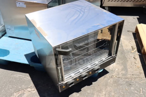 Brand new Vollrath CO4-120HS half-size countertop convection oven. Measures 23 5/16" x 25 7/16" x 18 7/16". 120V, 12A.
