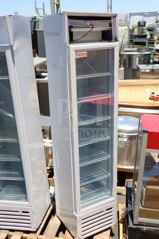 Brand new Galaxy GDN-5 swing glass door merchandiser refrigerator, white, LED lit, 74" tall, slight dent, model GDN-5.