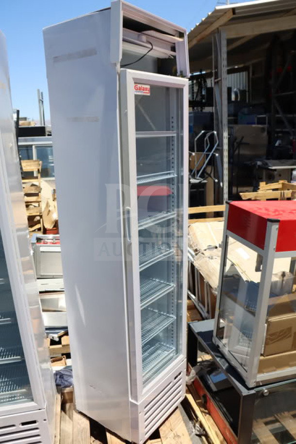 Brand new Galaxy GDN-5 white swing glass door merchandiser refrigerator with red, white, and blue LED lighting.