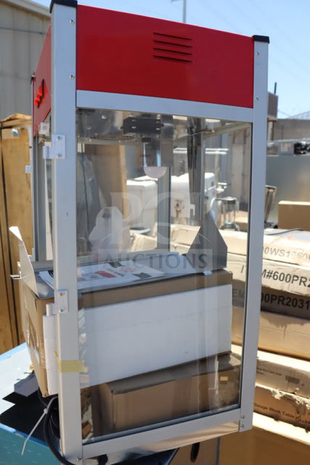 Carnival King PM1360 12 oz. commercial popcorn machine, brand new with scratches and dents; 120V, 1360W, visible labels.