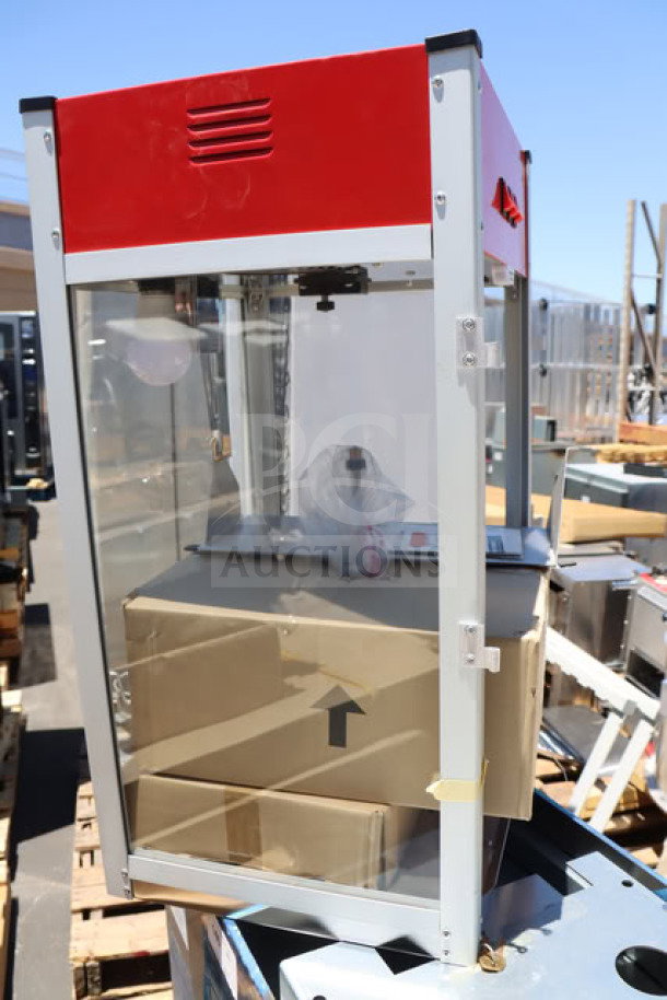 BRAND NEW Carnival King PM1360 12 oz. Popcorn Machine, scratch-n-dent condition, 120V, 1360W, red and silver frame.