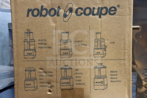 Robot Coupe R2CLR DICE food processor box with clear label; top of box damaged.