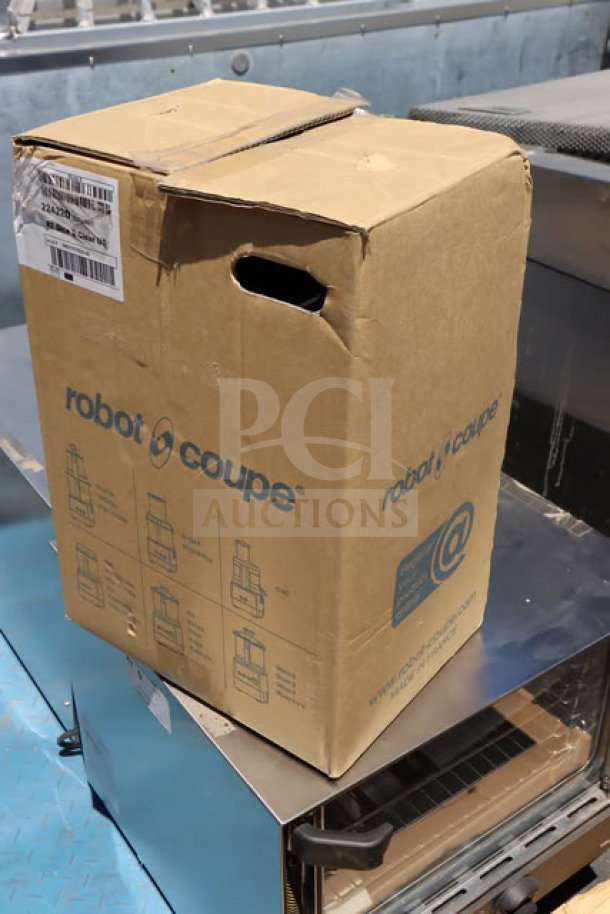 Brand new Robot Coupe R2CLR DICE food processor in box, top damaged. Features 3 qt. clear bowl, continuous feed, 4 discs, 2 hp.