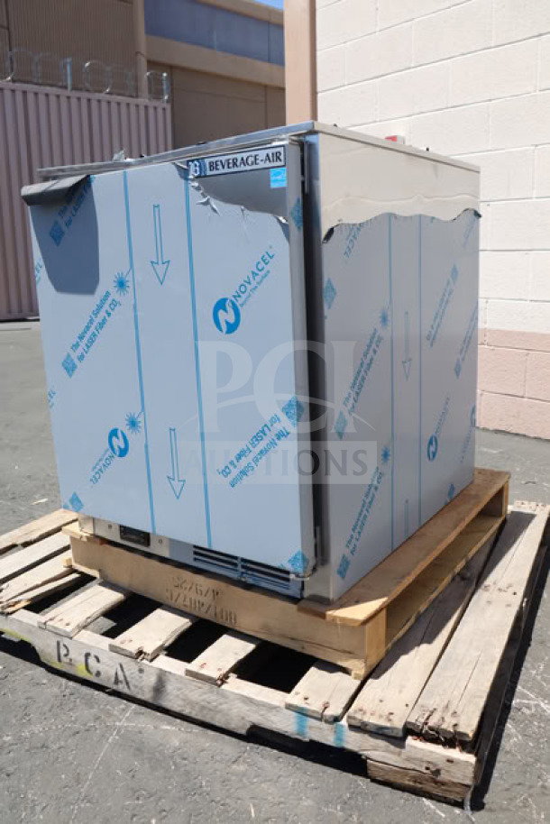 Brand new Beverage-Air UCF24AHC 24" undercounter freezer on wooden pallet, protective film partially intact. Model: UCF24AHC.