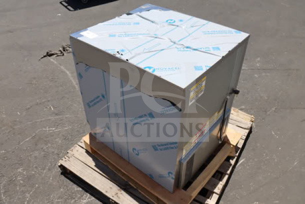 Beverage-Air UCF24AHC 24" undercounter freezer, brand new, with visible dents, on a pallet. S/N: 15504012.