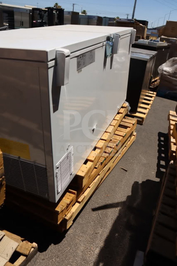Brand new Galaxy CF30HC commercial chest freezer, 30 cu. ft., 115V, 2.1A, visible scratch-n-dent, on a pallet, tags visible.
