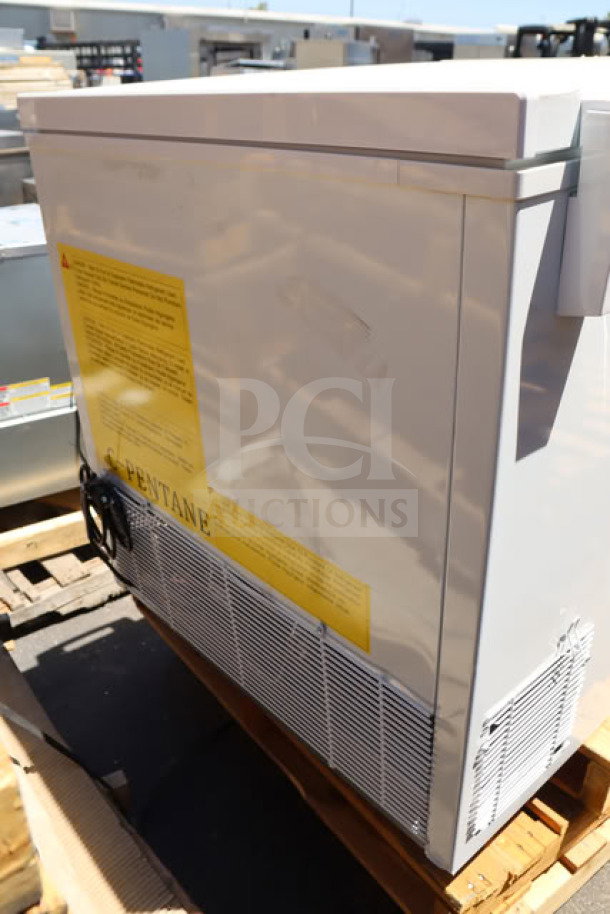 Brand new Galaxy CF30HC commercial chest freezer, 30 cu. ft., 115V, 2.1A. Scratch-and-dent condition. Visible warning labels.
