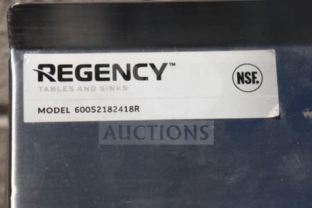 Regency 600S2182418R 2-bowl sink with 18" right drainboard, 16 gauge. Brand new, out of box. NSF certified label visible.