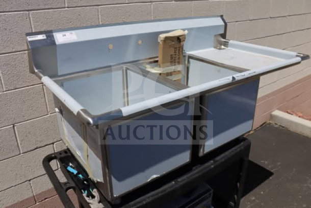 Brand new Regency 600S2182418R dual bowl sink, 18"x24"x14", 18" right drainboard, 16-gauge steel, no box.