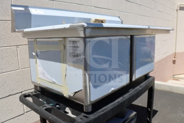 Brand new Regency 600S2182418R 2-bowl sink, 18x24x14", 16 gauge, with right drainboard, tags intact.