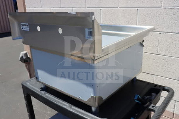 Brand new Steelton 522CS12424 commercial sink, one compartment, visible scratches and dents, stainless steel construction.