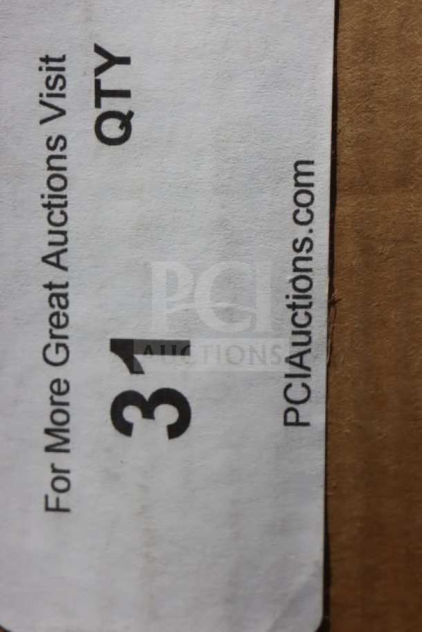 Brand new cocktail table; box is damaged. Label reads "31," referencing PCI Auctions.