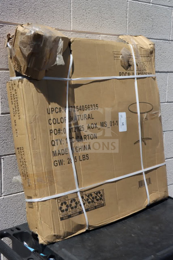 Brand new cocktail table in damaged box. Box shows "Color: Natural," "Made in China," "GW: 25.5 lbs."