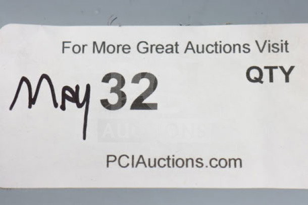 Sticker displaying auction site information with "May 32" noted.