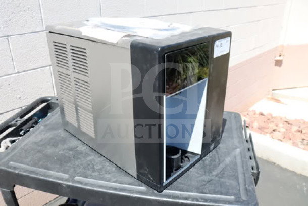 Brand new Follett 7CI114A-IW-NF-ST-00 countertop ice maker and water dispenser, air-cooled, 7 lb. bin, visible scratch-n-dent condition.