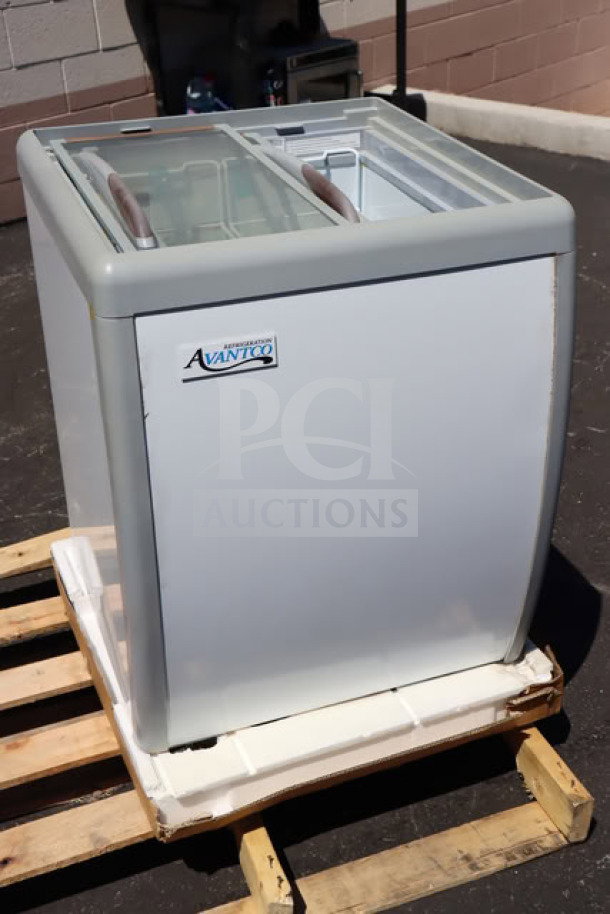 Brand new Avantco DFF6-HCL ice cream freezer; flat top, 26" x 28" x 34", scratch-n-dent, on pallet, model label visible.