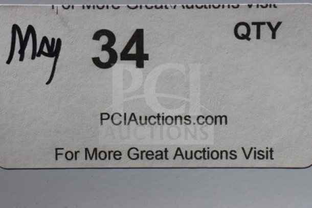 Alt text: Auction label with handwritten "May 34 QTY," PCIauctions.com URL, and promotional text for more auctions.