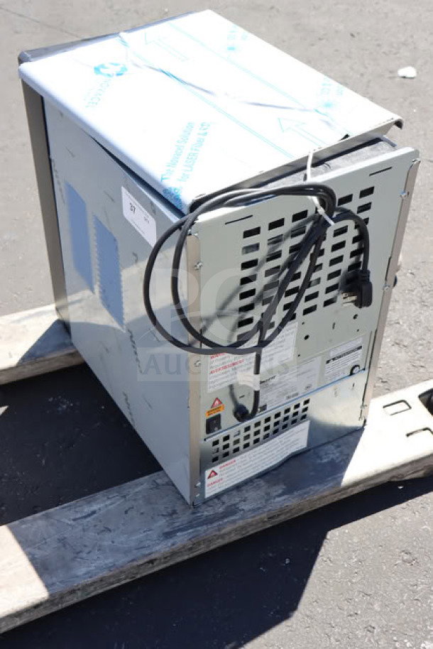 BRAND NEW SCRATCH-N-DENT Follett 15CI114A-IW-NF-ST-00 ice maker, countertop model. Air-cooled, 15 lb. bin, 115V, visible power cord.
