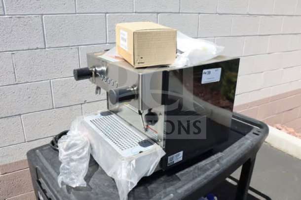 Brand new Estella Caffe ECEM1C compact automatic espresso machine, 110V, with slight cosmetic dents; includes original packaging.