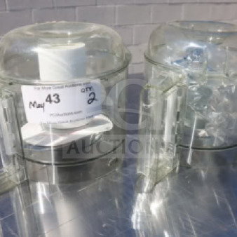 Two clear Robot Coupe food processor bowls on a metal surface, each with handles; auction label indicates quantity 2.