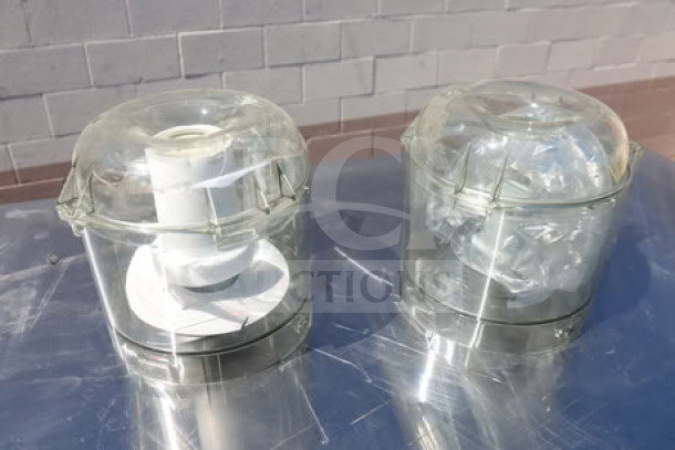 Two Robot Coupe processors with transparent bowls, visible lids, and internal components. Used condition.