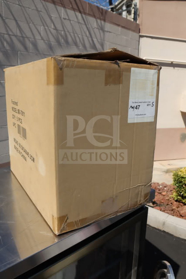 Box containing 4 new Mount-It! MI-7811 dual pedal tilt adjustable ergonomic footrests, black, sealed, shipping label visible.
