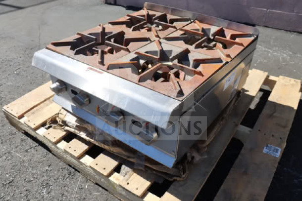 BRAND NEW Cooking Performance Group R-CPG-24-NL 4 Burner Gas Range, 88,000 BTU, surface rust visible, on pallet.