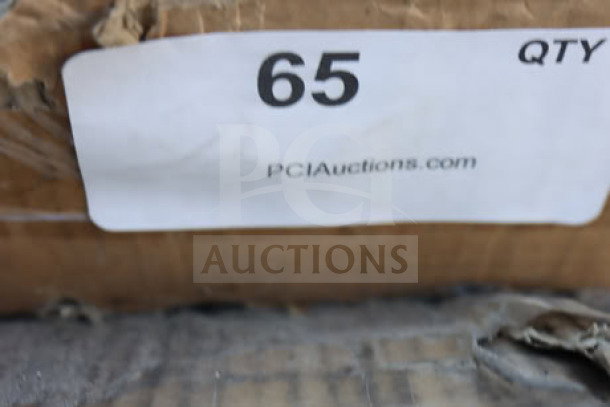 Label on worktable packaging, marked "65 QTY," from PCI Auctions. Package appears slightly worn.