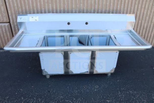 Brand new Steelton 522CS31014LR 54" commercial sink, three compartments, two 12" drainboards, scratch-n-dent condition.