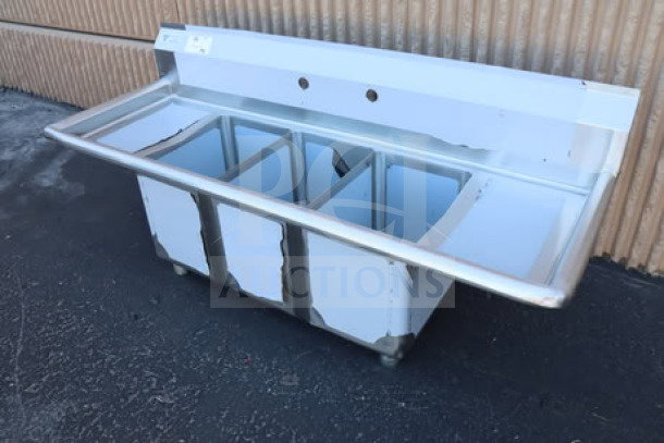 Steelton 522CS31014LR 54" commercial sink with three compartments and two 12" drainboards, scratch-n-dent condition.
