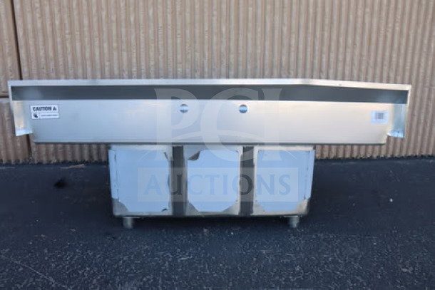 Brand new Steelton 54" 522CS31014LR three-compartment sink with two 12" drainboards, scratch-and-dent condition.