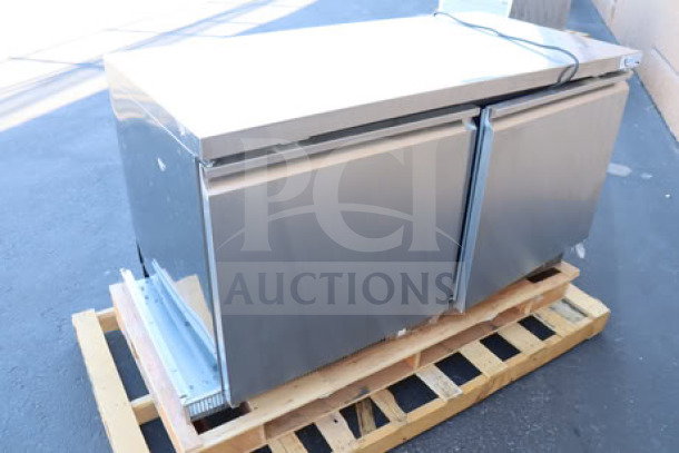 Brand new Avantco ZUC-60F-HC 60" undercounter freezer, front breathing. Minor dents, unit shifted right. Serial: 072768703 6674 2509.