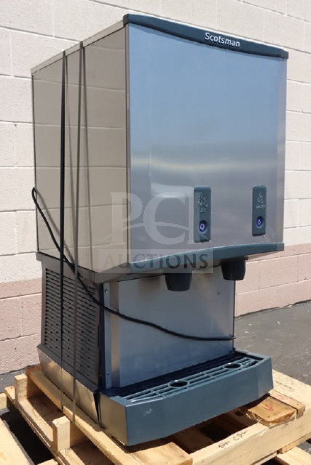 Brand new Scotsman HID540WBX-1A ice machine and water dispenser, water-cooled, 40 lb. bin capacity, push button dispensing.