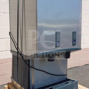 Brand new Scotsman HID540WBX-1A ice machine and water dispenser, water-cooled, 40 lb. bin capacity, push button dispensing.