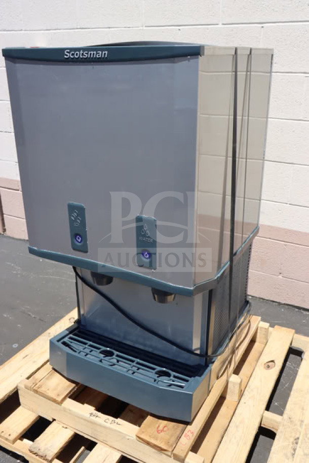 Brand new Scotsman HID540WBX-1A countertop nugget ice machine, water-cooled, 40 lb bin, push button dispense, minor scratches.