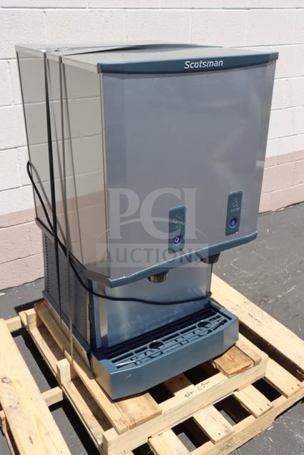 Brand new Scotsman HID540WBX-1A ice machine and water dispenser, 40 lb. bin, water-cooled, scratch-n-dent condition.
