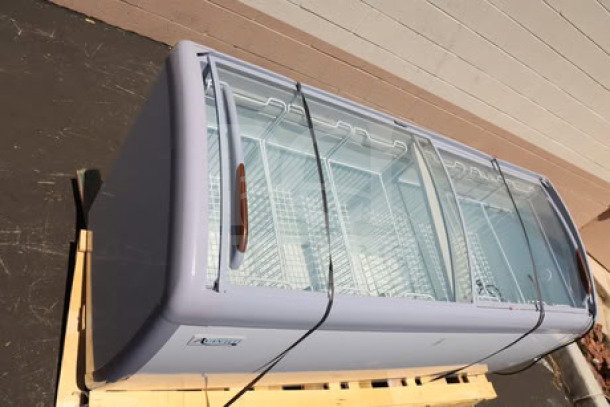 Avantco DFC20-HCL 70 7/8" curved top display ice cream freezer, new, scratch-n-dent, 115V, on pallet.