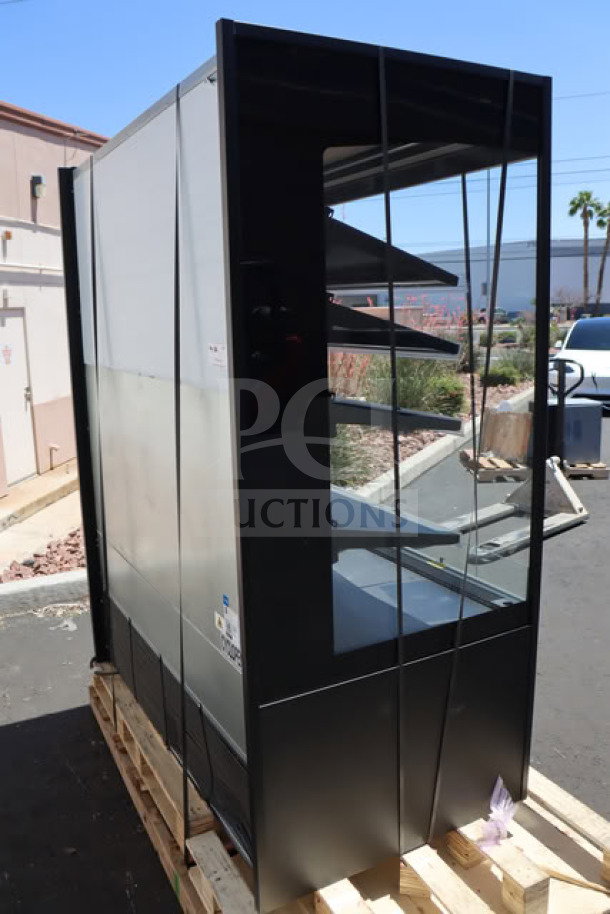 Avantco VOA-60-B black open air merchandiser, 59 1/8", LED lights loose, dented air grate, new condition, S/N: 1771910150029.