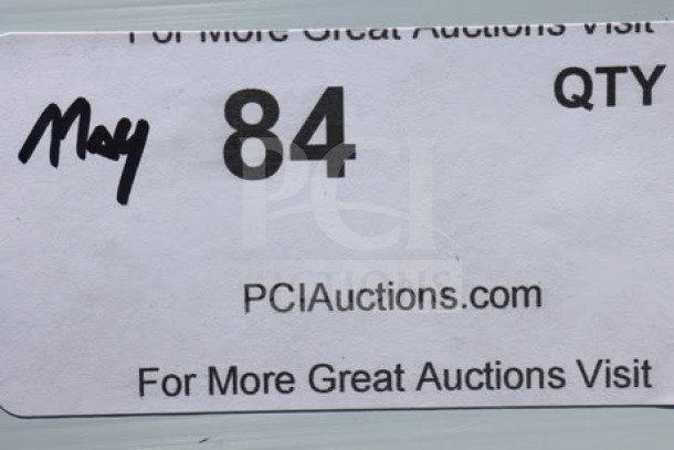 Auction label showing "May 84," quantity, and "PCIAuctions.com" on a white background.