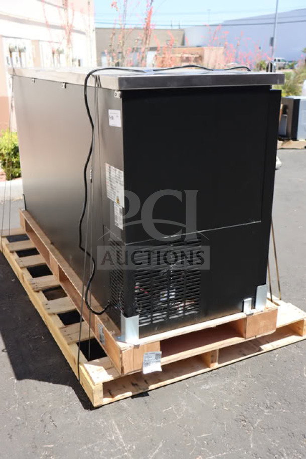 Brand new Avantco UBB-72-HC 73" black back bar refrigerator on pallet, with LED lighting; tested and in working order.