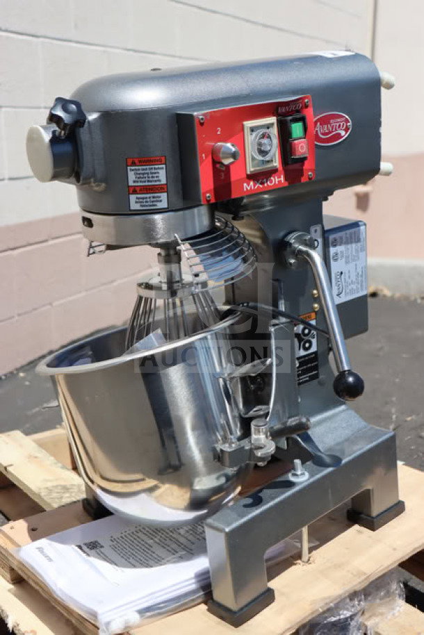 Brand new Avantco MX10H 10 Qt. planetary stand mixer with guard, standard accessories, and visible control panel. 