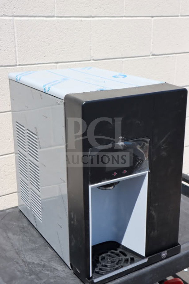 Follett 15CI114A-IW-NF-ST-00 Champion countertop ice maker and water dispenser, 15 lb. bin, minor dents, new condition.