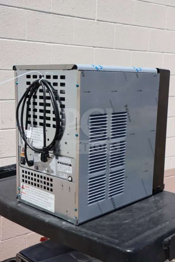 BRAND NEW Follett 15 Series Ice Maker, model 15CI114A-IW-NF-ST-00, minor dents, 15 lb. bin, 100 lb. capacity, 115V.