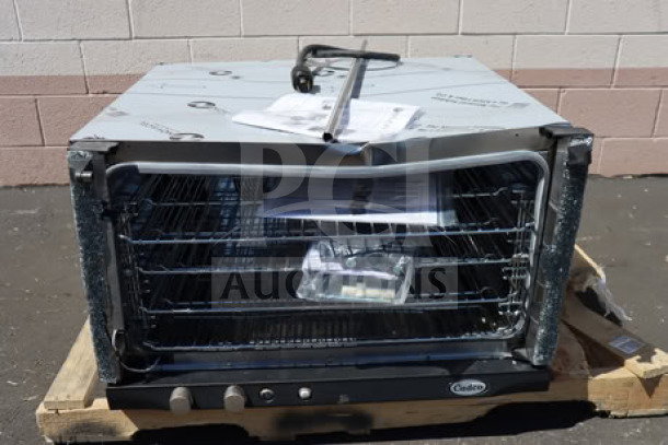 BRAND NEW SCRATCH-N-DENT Cadco Rossella XAF-193 convection oven on pallet, visible controls, manual, 4 shelves, 208-240V.