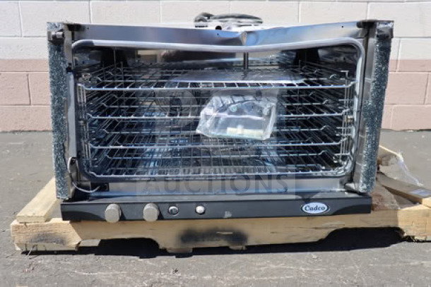 Brand new Cadco Rossella XAF-193 convection oven, 4-shelf, manual controls, scratches on exterior, visible wiring, 208-240V.