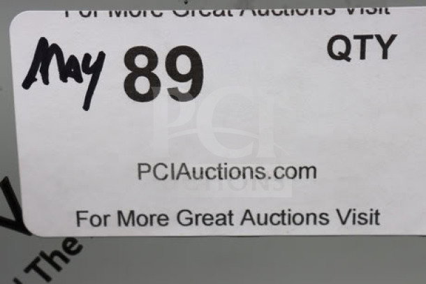 Image shows a PCI Auctions label marked "May 89 QTY". The label includes the website PCIauctions.com.